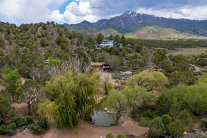 Property view of mountains featuring a water view