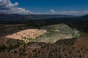 Birds eye view of property with a mountain view