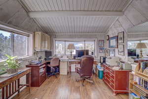 Office with wood ceiling, light hardwood / wood-style flooring, and vaulted ceiling with beams