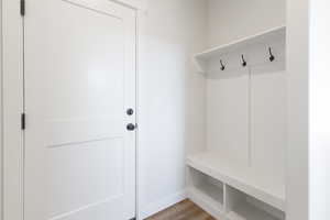 Mudroom with light hardwood / wood-style flooring