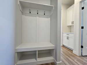 Mudroom featuring light wood-type flooring