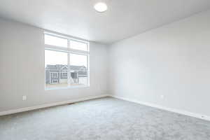 View of carpeted spare room