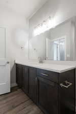 Bathroom featuring vanity and hardwood / wood-style floors