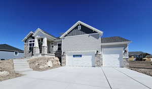 Craftsman-style house featuring a garage