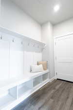 Mudroom with dark hardwood / wood-style floors