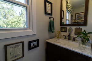 Bathroom with vanity and a healthy amount of sunlight