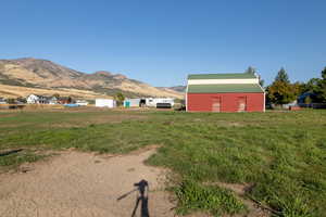 View of yard with an outbuilding and a mountain view