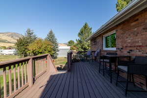 Wooden deck featuring a mountain view