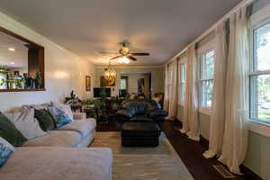 Main Living room featuring plenty of natural light and dark hardwood / wood-style floors