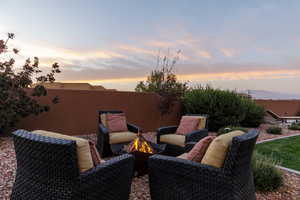 Patio terrace at dusk with an outdoor fire pit