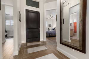 Entrance foyer featuring hardwood / wood-style floors and ceiling fan