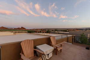 Patio terrace at dusk with a balcony