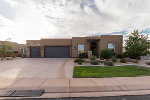 Adobe home featuring a garage