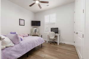 Bedroom featuring ceiling fan and light hardwood / wood-style floors