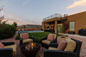 Patio terrace at dusk with an outdoor fire pit