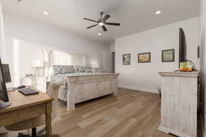 Bedroom with light hardwood / wood-style flooring and ceiling fan