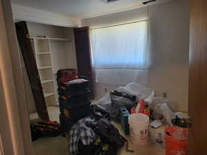 Bedroom with a closet, a textured ceiling, and carpet flooring