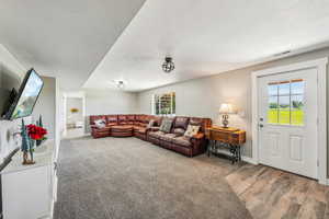 Living room with hardwood / wood-style flooring