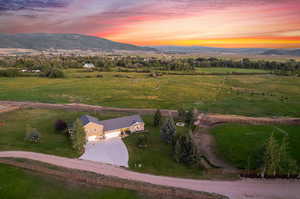 Aerial view at dusk with a mountain view and a rural view