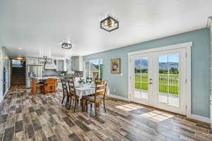 Dining area featuring french doors, dark hardwood / wood-style flooring, and sink