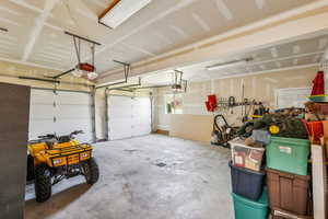 Garage featuring a garage door opener