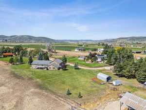 Drone / aerial view with a mountain view and a rural view