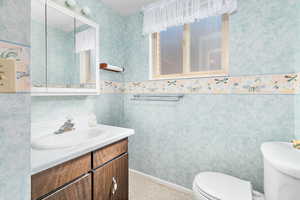 Bathroom with vanity and toilet