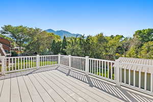 Wooden deck featuring a mountain view