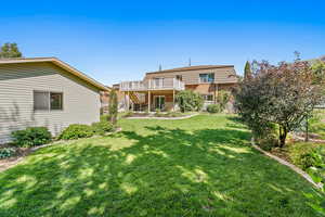 View of back yard featuring a wooden deck