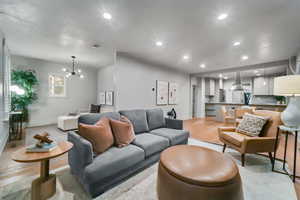 Living room featuring a notable chandelier