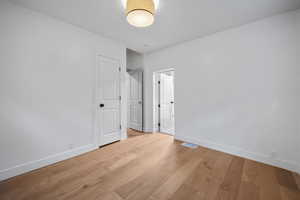 Unfurnished bedroom featuring light hardwood / wood-style floors