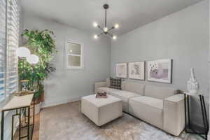 Living room featuring a chandelier