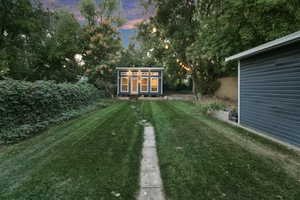 View of yard at dusk