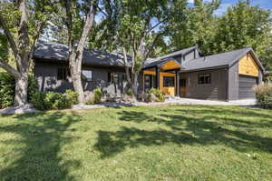 View of front of property with a front lawn