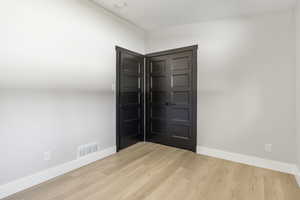 Spare room with light hardwood / wood-style flooring