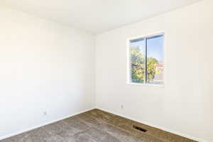 Empty room featuring carpet floors