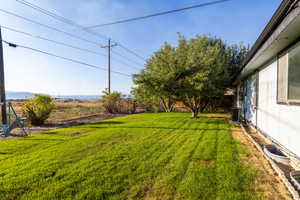 View of yard featuring central air condition unit