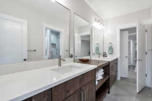 Bathroom featuring vanity and concrete flooring