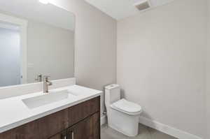 Bathroom with vanity and toilet