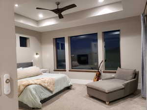 Bedroom with ceiling fan and carpet flooring