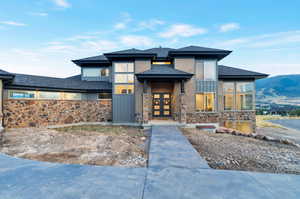 View of front facade with a mountain view and french doors