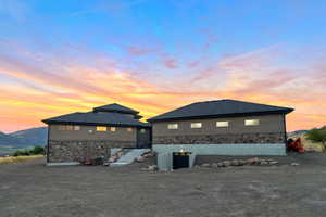 Property exterior at dusk featuring a mountain view