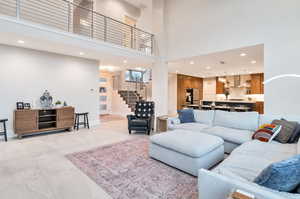 Living room featuring a towering ceiling