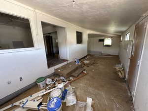 Interior space featuring a textured ceiling