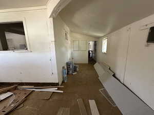 Hallway featuring lofted ceiling