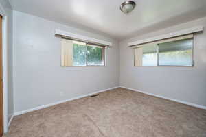 Unfurnished room with carpet flooring