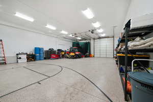 Detached Garage, 14' High doors, Tandem depth, epoxy floor w/ batting net and basketball standard