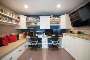 Home office featuring built in desk