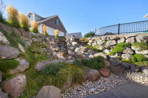 View of yard featuring a garage