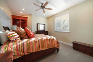 Bedroom with light carpet and ceiling fan